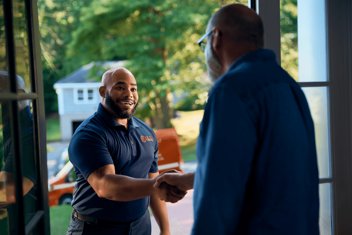 Technician shaking customers hand