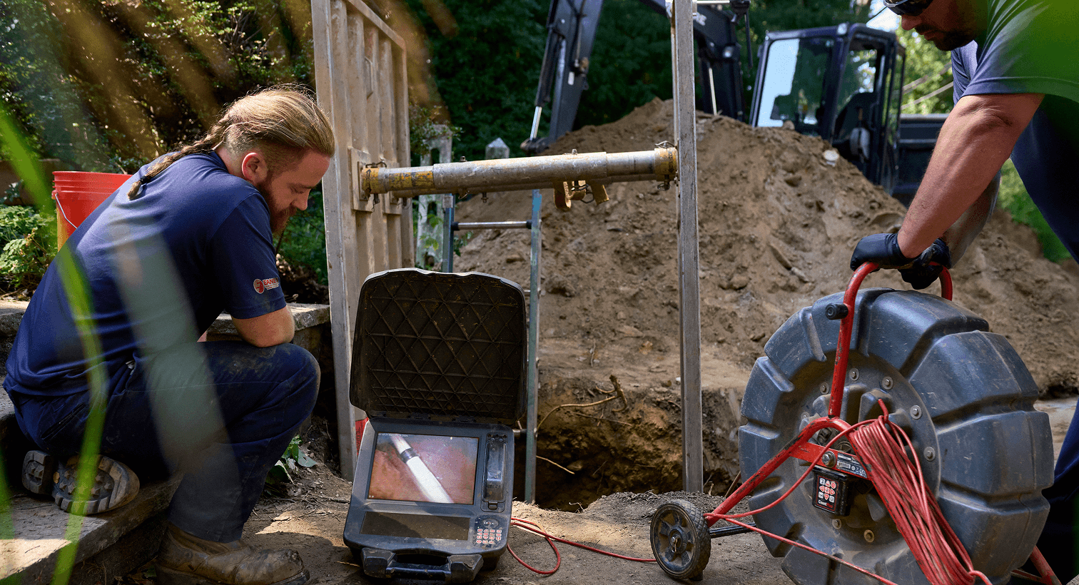 Tech inspecting sewer line