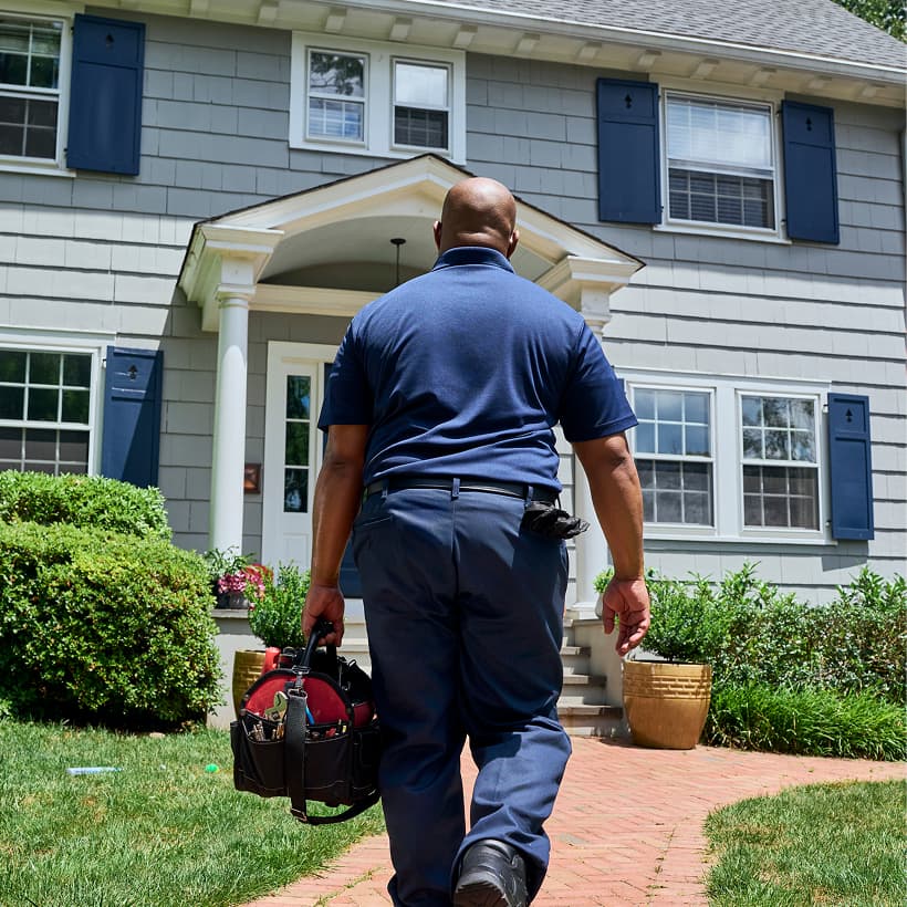 A Eanes technician arrives at a home ready to provide expert HVAC, plumbing, and electrical services.