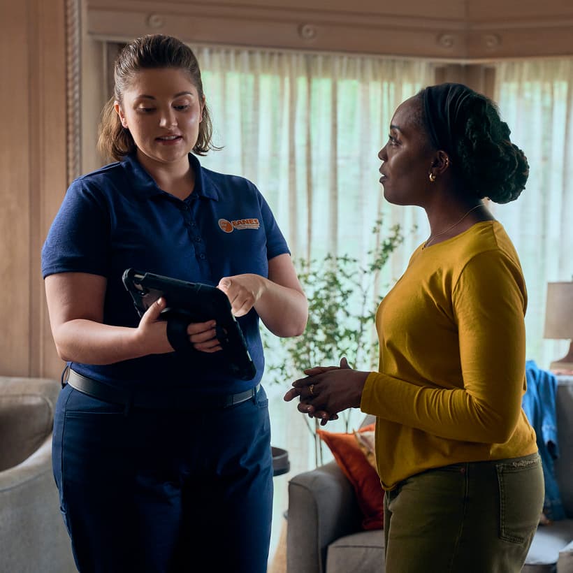 An Eanes Comfort Advisor discuss our Comfort360 Membership benefits with a homeowner.