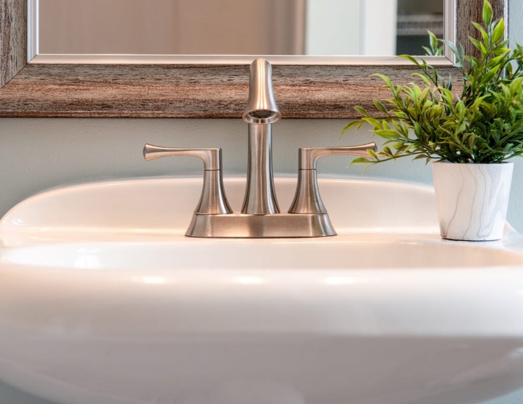 bathroom sink with brushed nickel faucet